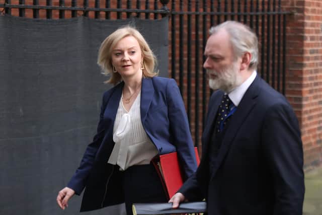 Foreign Secretary Liz Truss and Tim Barrow, Political Director at the Foreign, Commonwealth and Development Office, walk from 10 Downing Street, London, where the government's Cobra emergency committee has been meeting to discuss latest developments regarding Ukraine.