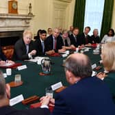 Will Chancellor Rishi Sunak, seen in Cabinet sitting next to Boris Johnson, make amends for his party's economic policies? (Picture: Ben Stansall/PA)
