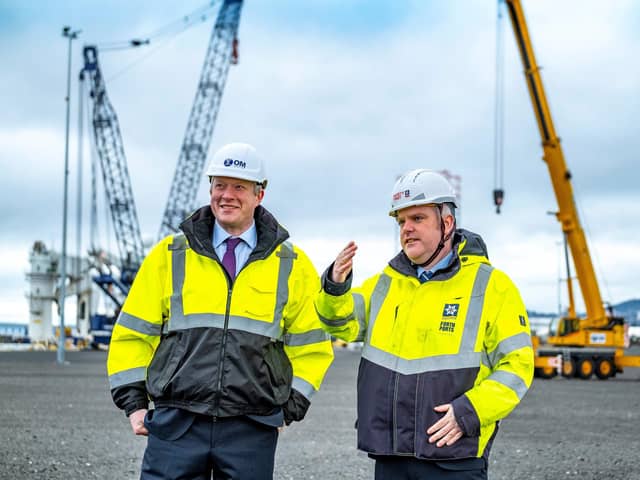 Alex Fyfe, managing director of OM Heavy Lift, and David Webster, director of energy at Forth Ports on site in the Port of Dundee with OMHL’s heavy lift cranes in the background. Picture: Peter Devlin