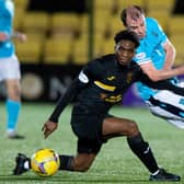 Paul McGowan and Livingston's Stephane Omeonga jostle for the ball in midfield as Dundee fell 2--0 to their hosts (Photo by Mark Scates / SNS Group)