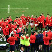 British & Irish Lions players and staff form a huddle to celebrate their victory over South Africa in the first Test.