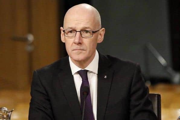 John Swinney says some pupils will have more "face to face" time in schools than others