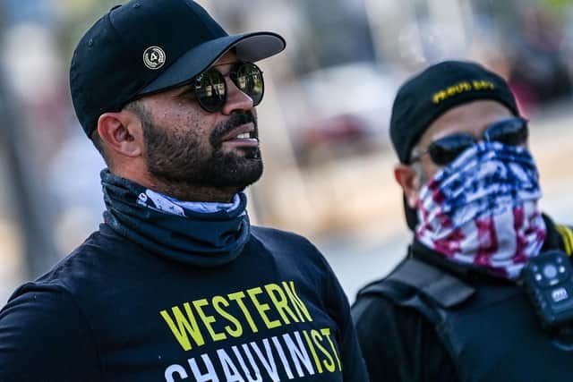 Former leader of the Proud Boys Enrique Tarrio (left), wearing a shirt supporting Derek Chauvin, joins a counter-protest where people gathered to remember George Floyd. Picture: Chandan Khanna/AFP via Getty Images