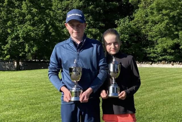 Fraser and Stella Walters show off their trophies after wins in their respective events at Royal Musselburgh in the U.S. Kids Golf European Championships in East Lothian.