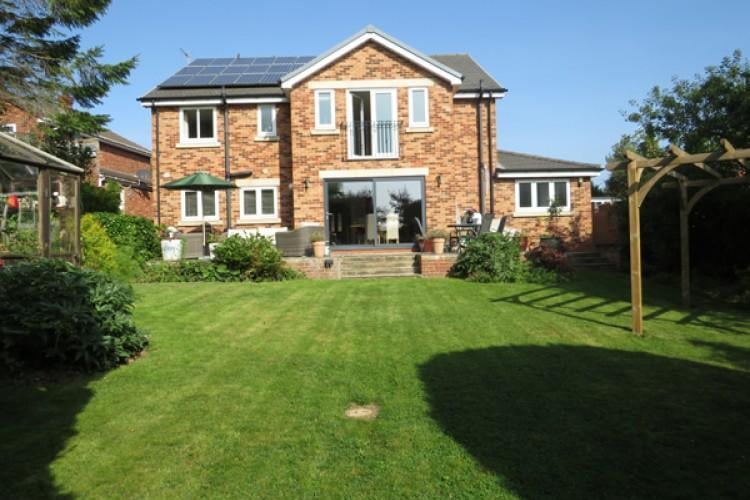 The home has a large garden and four double bedrooms.