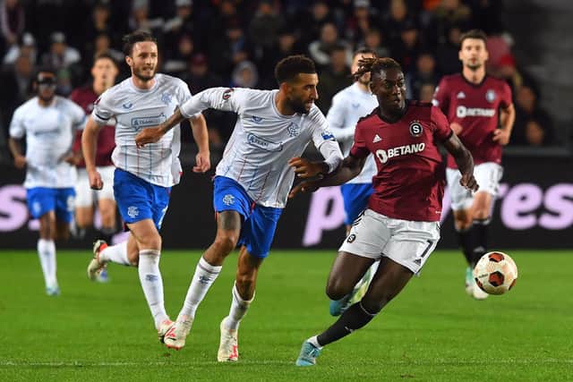 Sparta Prague's forward Victor Oluyemi Olatunji and Rangers' defenderConnor Goldson vie for the ball.