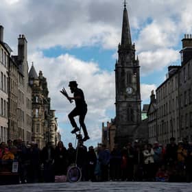 A juggler performs for tourists on Royal Mile during the Edinburgh Festival Fringe. Picture: Jeff J Mitchell/Getty Images