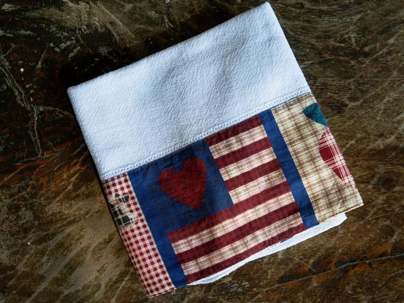 "A pretty face suits a dish cloth" - basically there's no need to fuss over what you're wearing because beautiful people look good in anything anyway, even a dish cloth.