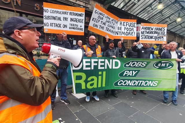 RMT members during a previous strike outside Glasgow Central Station (Picture: John Devlin)
