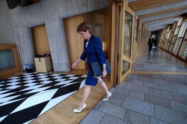 Nicola Sturgeon walking to her daily briefing