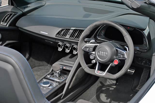 The R8's cabin is compact but comfortable and surprisingly refined with the roof up