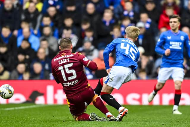 Motherwell's Dan Casey tackles Rangers' Ross McCausland, who was unable to continue. (Photo by Rob Casey / SNS Group)