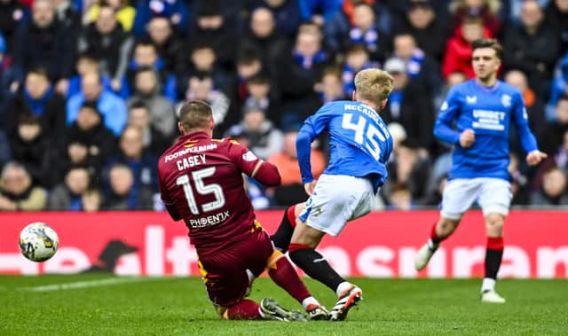 Motherwell's Dan Casey tackles Rangers' Ross McCausland, who was unable to continue. (Photo by Rob Casey / SNS Group)