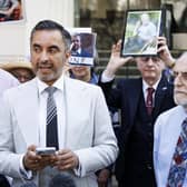 Aamer Anwar (centre), lead solicitor for the Scottish Covid Bereaved group, speaks outside the UK Covid-19 Inquiry at Dorland House in London. Picture: Belinda Jiao/PA Wire