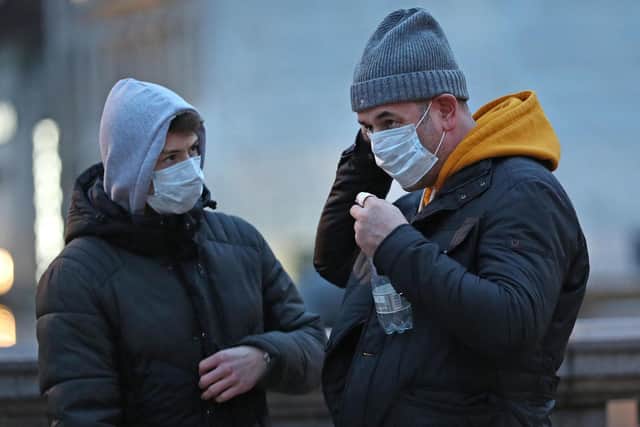 People wearing face masks in London. The coronavirus has now been identified in Scotland. Yui Mok/PA Wire