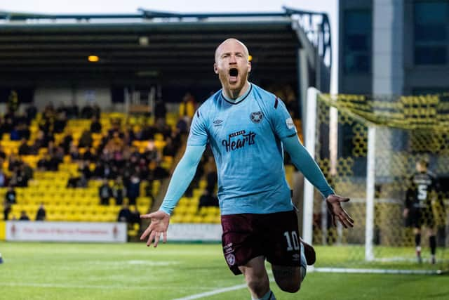 Liam Boyce wheels away after putting Hearts ahead.