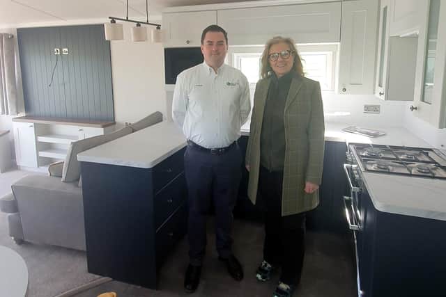 Frank Maguire shows MSP Rachael Hamilton one of his park's holiday home interiors