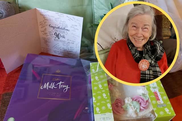 Betty Mcgill beaming on her 90th birthday having received a package of gifts from Tesco delivery drivers picture: supplied