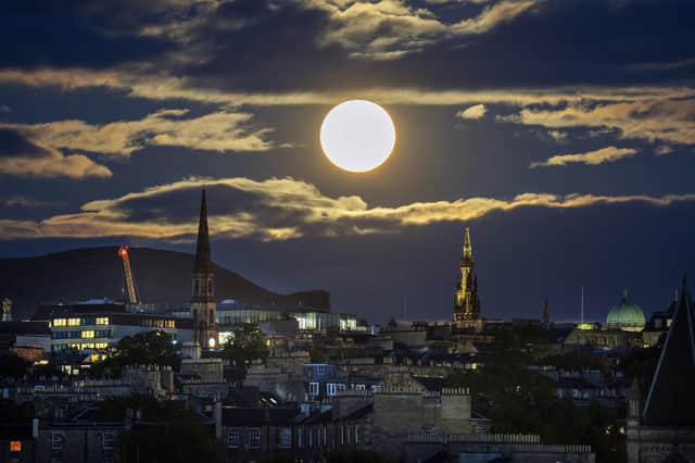 The super blue moon rises over Edinburgh. The blue moon refers to the second full moon in one calendar month, which occurs approximately once every two or three years. This one is also supermoon - when the Earth's natural satellite will appear about 14% bigger and 30% brighter in the sky as it reaches its closest point to Earth. Picture date: Wednesday August 30, 2023. PA Photo.
