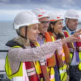 Carole Cran, CFO, Forth Ports; Richard Haydock, project director, offshore wind, BP; Céline Combé, EnBW project director; David Webster, director of energy, Forth Ports; against the backdrop of the Port of Leith. Picture: Peter Devlin