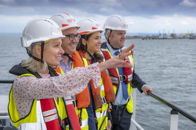 Carole Cran, CFO, Forth Ports; Richard Haydock, project director, offshore wind, BP; Céline Combé, EnBW project director; David Webster, director of energy, Forth Ports; against the backdrop of the Port of Leith. Picture: Peter Devlin