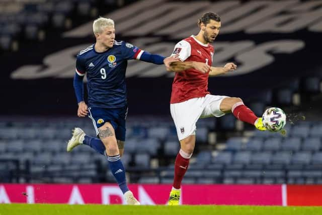 Lyndon Dykes battles for possession with Austria defender Aleksandar Dragovic on a frustrating night at Hampden for the Scotland striker. (Photo by Alan Harvey / SNS Group)