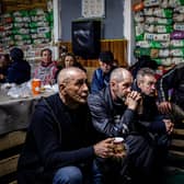 Ukrainians take shelter in a humanitarian aid centre in the besieged town of Bakhmut on Monday (Picture: Dimitar Dilkoff/AFP via Getty Images)