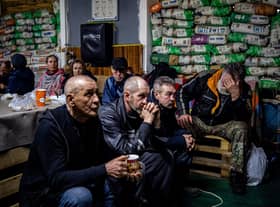 Ukrainians take shelter in a humanitarian aid centre in the besieged town of Bakhmut on Monday (Picture: Dimitar Dilkoff/AFP via Getty Images)