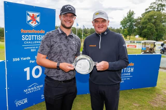 Englishman Sam Bairstow receives the trophy from Paul Lawrie following his one-stroke victory in the Farmfoods Scottish Challenge supported by The R&A at Newmachar. Picture: Kenny Smith/Getty Images.