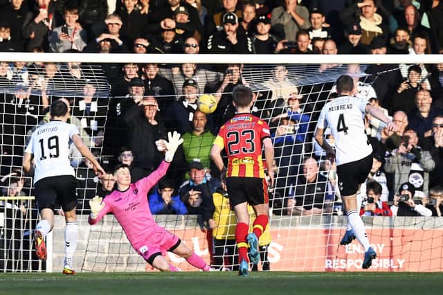 Aaron Muirhead converts an early penalty to put Ayr United ahead against Partick Thistle.