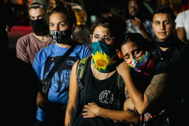 Protestors hold vigil at the site of Tuesday night's shooting (Getty Images)