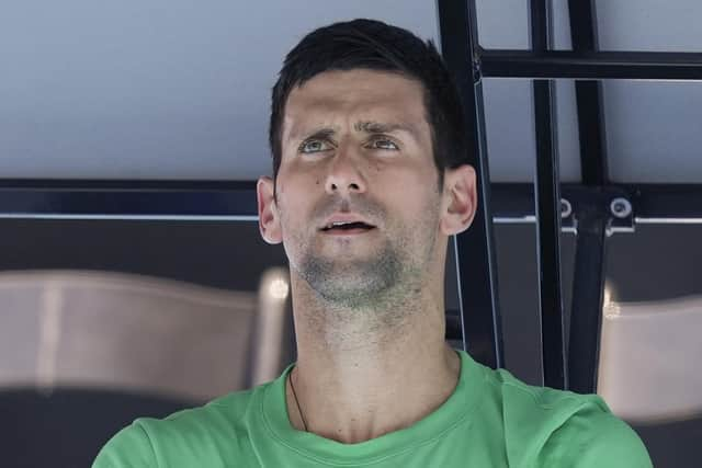 Defending men's champion Serbia's Novak Djokovic rests during a practice session on Margaret Court Arena ahead of the Australian Open tennis championship in Melbourne, Australia on Jan. 13, 2022.  (AP Photo/Mark Baker, File)