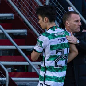 Celtic's Tomoki Iwata gets a pat on the back from manager Brendan Rodgers after being subbed off at Motherwell. (Photo by Craig Foy / SNS Group)