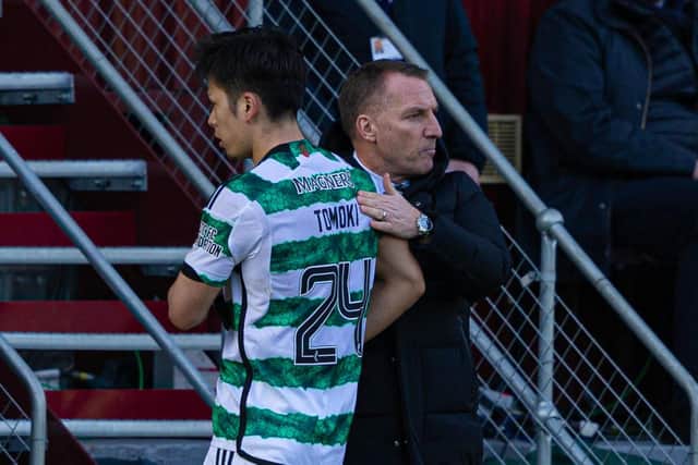 Celtic's Tomoki Iwata gets a pat on the back from manager Brendan Rodgers after being subbed off at Motherwell. (Photo by Craig Foy / SNS Group)