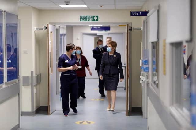 Addressing MSPs on Tuesday afternoon, Ms Sturgeon said the new variant of Covid-19, which was first identified in the southeast of England in December 2020, now accounts for around 73 per cent of all cases of the virus in Scotland. (Photo by Russell Cheyne - Pool/Getty Images)