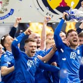 St Johnstone defender Jamie McCart holds the Scottish Cup aloft during the post-match celebrations at Hampden. (Photo by Craig Williamson / SNS Group)