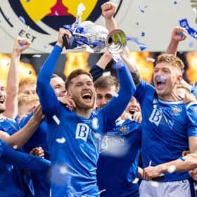 St Johnstone defender Jamie McCart holds the Scottish Cup aloft during the post-match celebrations at Hampden. (Photo by Craig Williamson / SNS Group)