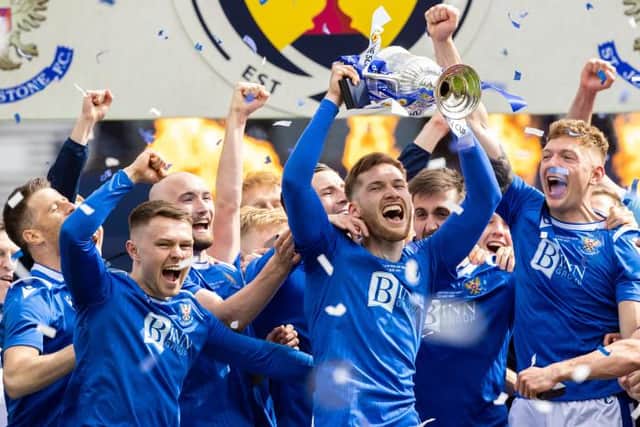 St Johnstone defender Jamie McCart holds the Scottish Cup aloft during the post-match celebrations at Hampden. (Photo by Craig Williamson / SNS Group)