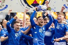 St Johnstone defender Jamie McCart holds the Scottish Cup aloft during the post-match celebrations at Hampden. (Photo by Craig Williamson / SNS Group)