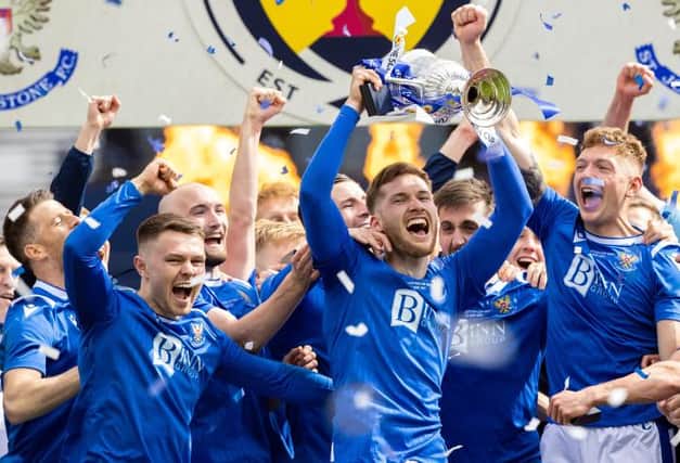 St Johnstone defender Jamie McCart holds the Scottish Cup aloft during the post-match celebrations at Hampden. (Photo by Craig Williamson / SNS Group)