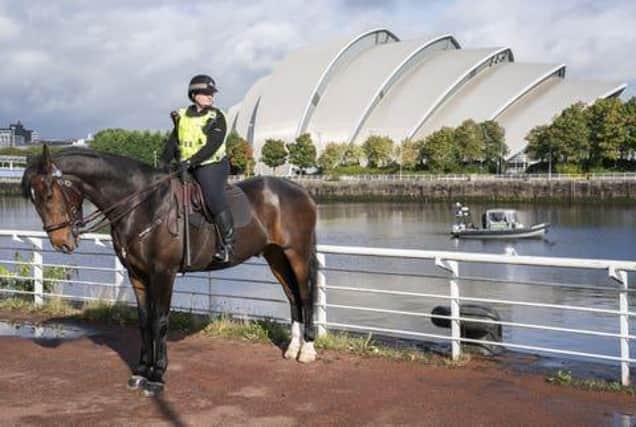 Laura Kinlan riding Inverness alongside the River Clyde near the COP26 venues as Police Scotland counter terrorism announce a Project Servator campaign> Picture; PA