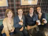 Debbie Meyers, 61, from South California with her daughter Katie Carter, 27, future son-in-law Jason Stilgebouer, 26, and niece Rachel Montemayor, 29, in the Balmoral Bar, Ballater, to watch the funeral of Elizabeth II.