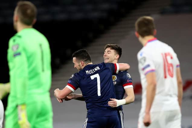 John McGinn of Scotland celebrates with team mate Kieran Tierney after scoring their side's first goal during the FIFA World Cup 2022 Qatar qualifying match between Scotland and Faroe Islands at Hampden Park on March 31, 2021 in Glasgow, Scotland. (Photo by Ian MacNicol/Getty Images)