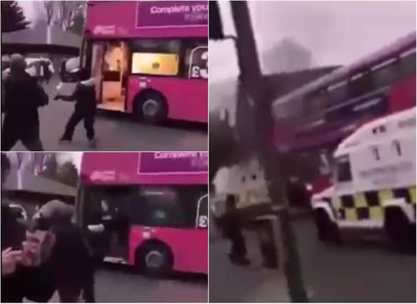 A video shows the moment Belfast rioters throw 'petrol bombs' into a bus, setting it alight.