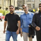From left: Qasim Sheikh, lawyer Aamer Anwar and Majid Haq arrive at the Scotland v New Zealand match at the Grange in Edinburgh yesterdayy. Pic: Lisa Ferguson
