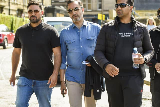 From left: Qasim Sheikh, lawyer Aamer Anwar and Majid Haq arrive at the Scotland v New Zealand match at the Grange in Edinburgh yesterdayy. Pic: Lisa Ferguson