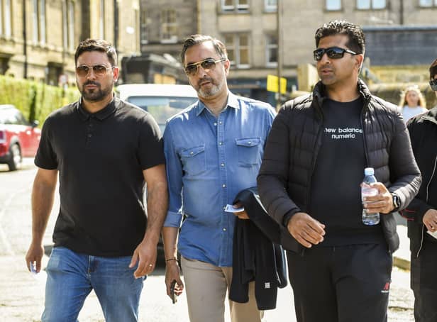 From left: Qasim Sheikh, lawyer Aamer Anwar and Majid Haq arrive at the Scotland v New Zealand match at the Grange in Edinburgh yesterdayy. Pic: Lisa Ferguson