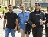 From left: Qasim Sheikh, lawyer Aamer Anwar and Majid Haq arrive at the Scotland v New Zealand match at the Grange in Edinburgh yesterdayy. Pic: Lisa Ferguson