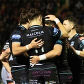 Glasgow Warriors' Facundo Cordero celebrates with Jamie Dobie (No 11) after scoring a second-half try against Dragons.