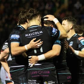 Glasgow Warriors' Facundo Cordero celebrates with Jamie Dobie (No 11) after scoring a second-half try against Dragons.